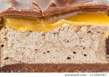 Chocolate bar in a cut. Slices of chocolate. Nougat and caramel. Chocolate bar in a cut. Slices of chocolate. Nougat and caramel. 121693567