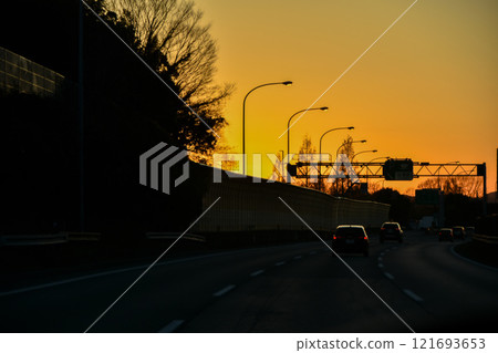 A view of the sunset from a Japanese highway A view of the sunset from a Japanese highway 121693653