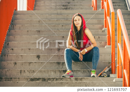 Skate girl on stairs with skateboard. 121693707