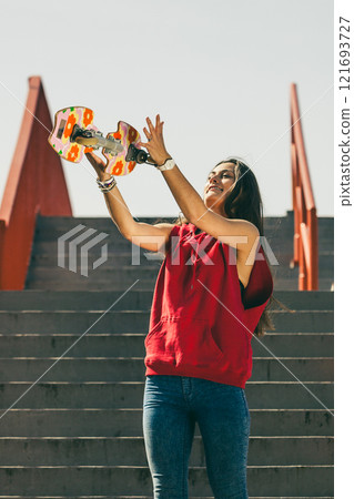 Urban skate girl with skateboard. Urban skate girl with skateboard. 121693727