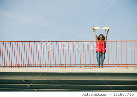 Urban skate girl with skateboard. Urban skate girl with skateboard. 121693730