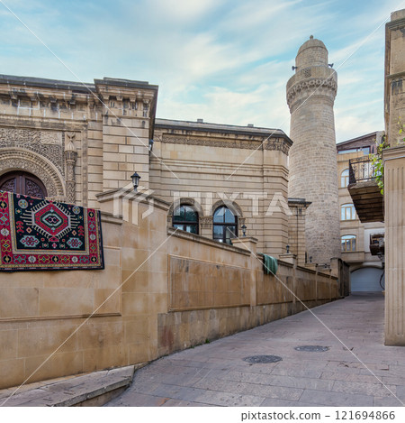 Explore Beylar Mosque in Icherisheher, Baku, Azerbaijan under a clear sky 121694866