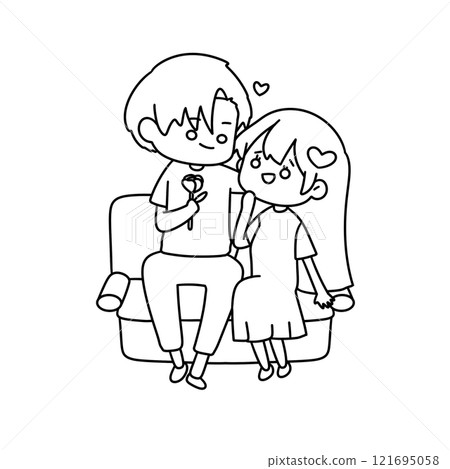 A boy and girl are sitting on a couch and holding a rose 121695058