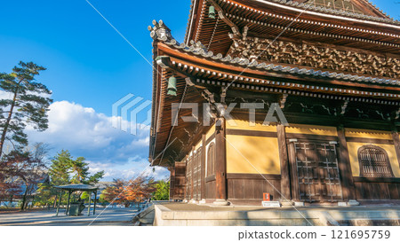 Golden Sunlight Bathes Ancient Temple in Kyoto. 121695759