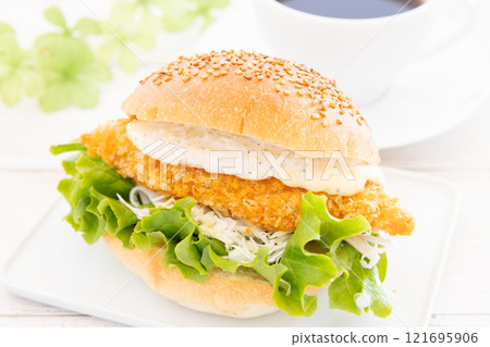 Delicious fish burger and hot coffee 121695906