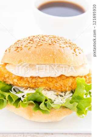 Delicious fish burger and hot coffee 121695910