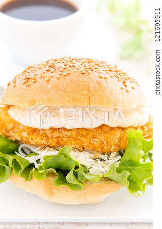 Delicious fish burger and hot coffee 121695911