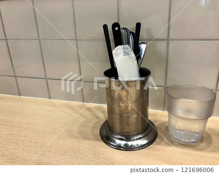 Chopsticks and forks on the counter Chopsticks and forks on the counter 121696006