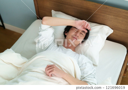 Middle-aged man sleeping 121696019