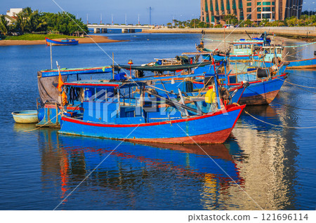 Traditional fishing boats near the colorful fishing port in Nha Trang, Vietnam 121696114