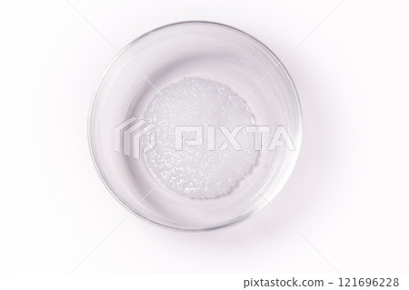 Deliquescence of sodium hydroxide (caustic soda) powder Deliquescence of sodium hydroxide (caustic soda) powder 121696228