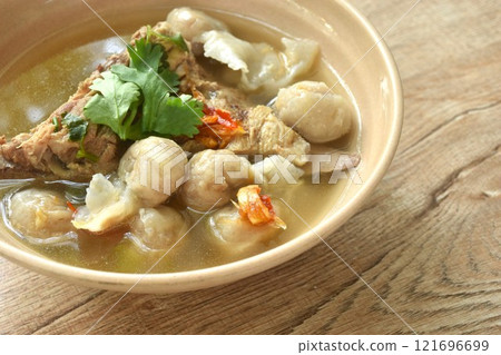 hot and spicy pork bone with fish dumpling soup on bowl   121696699