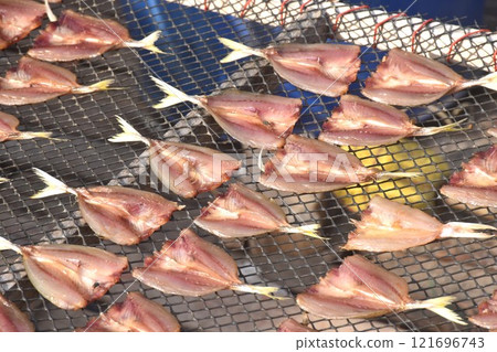 slice sea fish on net dry by sun for preserved food slice sea fish on net dry by sun for preserved food 121696743