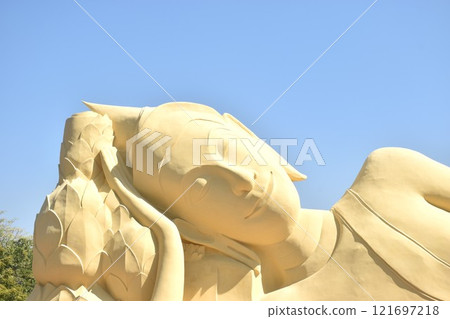 ancient reclining Buddha at Lokaya Sutha after renovate painting colors from white to yellow ancient reclining Buddha at Lokaya Sutha after renovate painting colors from white to yellow 121697218