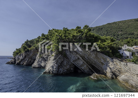 Montenegro, Petrovac, Coast landscape with vegetation. 121697344