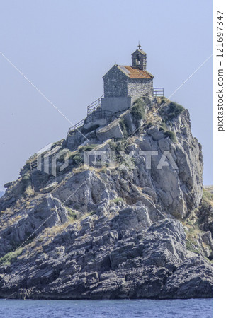 Montenegro, Petrovac, Small Orthodox Church on the Island of Nedjelja Sveta 121697347