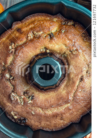baking background. Bakery. Autumn baking table scene with pumpkin pie ingredients on a dark wood background. baking background. Bakery. Autumn baking table scene with pumpkin pie ingredients on a dark wood background. 121697732