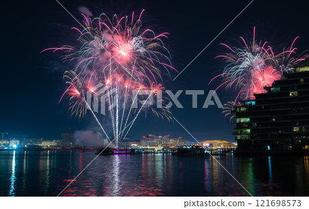 Fireworks illuminating the night sky above Yas Island seen from Al Raha in Abu Dhabi, UAE Fireworks illuminating the night sky above Yas Island seen from Al Raha in Abu Dhabi, UAE 121698573