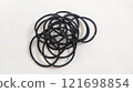Subject shot of black scrunchies. rubber band. The vogue accessories are isolated on the white background. 121698854