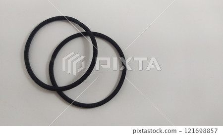 Subject shot of black scrunchies. rubber band. The vogue accessories are isolated on the white background. Subject shot of black scrunchies. rubber band. The vogue accessories are isolated on the white background. 121698857