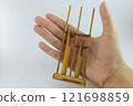 Miniature Angklung, the traditional sundanese musical instrument made from bamboo. Isolated on white background 121698859
