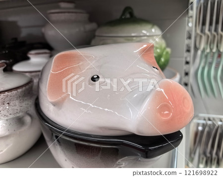 Unusual kitchen decor featuring a ceramic pig design for storage Unusual kitchen decor featuring a ceramic pig design for storage 121698922