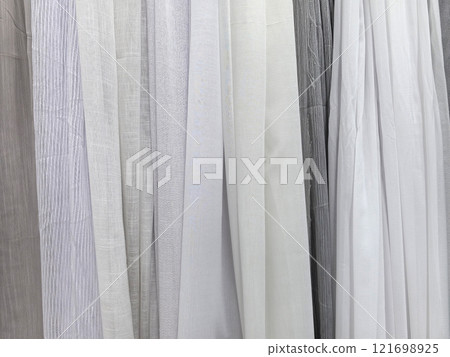 Soft textures in a cozy fabric store showcase neutral tones and elegance Soft textures in a cozy fabric store showcase neutral tones and elegance 121698925