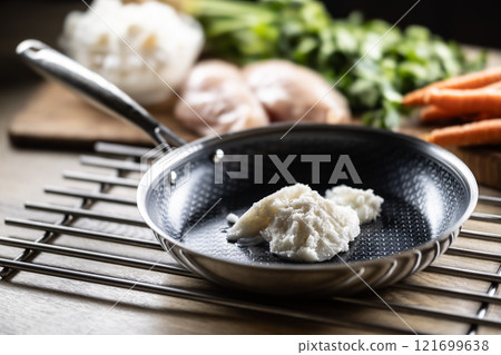 Pork lard in a non-stick cast iron pan. Pork lard in a non-stick cast iron pan. 121699638