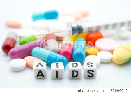 AIDS Acquired immunodeficiency syndrome word with pills and capsules medical drug. AIDS Acquired immunodeficiency syndrome word with pills and capsules medical drug. 121699641