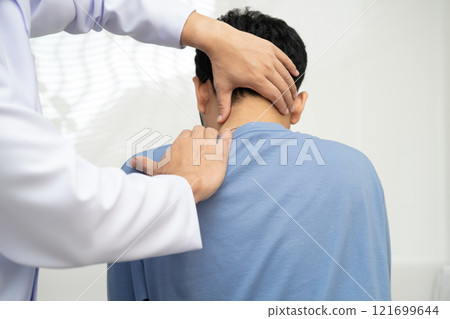Physical therapy, Asian therapist doctor treat perform pain young man in hospital. Physical therapy, Asian therapist doctor treat perform pain young man in hospital. 121699644