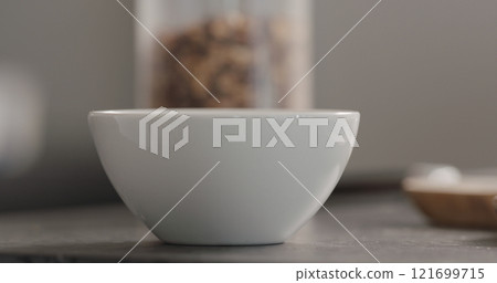 white bowl with granola on terrazzo countertop white bowl with granola on terrazzo countertop 121699715