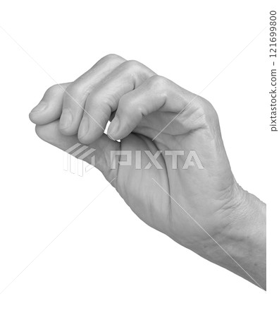 Hand with cross gesture. Senior woman s wrinkled hand holding a small sacred cross between thumb and 121699800