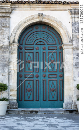 Green ornate closed gate, Sicily, Italy 121700021