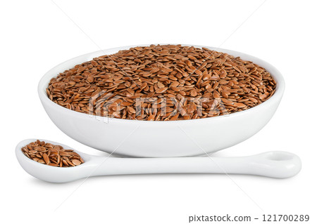 flaxseed in ceramic bowl isolated on white background. Top view. Flat lay 121700289