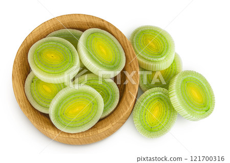 sliced Leek vegetable in wooden bowl isolated on white background. Top view. Flat lay 121700316