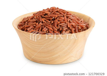red rice in a wooden bowl isolated on white background 121700329