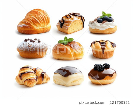 A variety of fresh pastries and desserts decorated with chocolate, powdered sugar and berries on a white background. Perfect for culinary themes or food advertising. 121700531