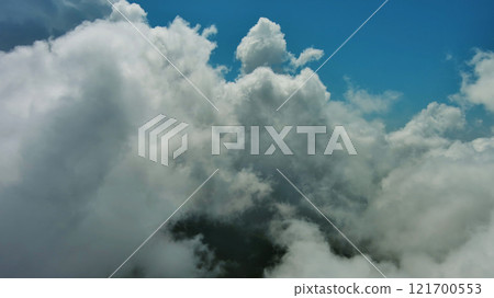 Flying through white fluffy clouds Flying through white fluffy clouds 121700553