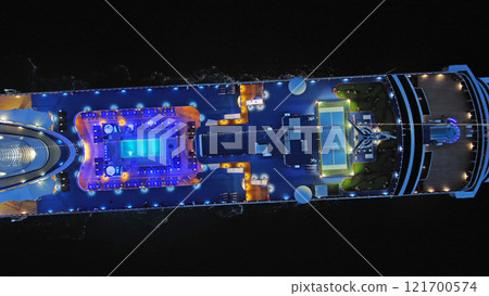 Illuminated cruise ship in sea at night Illuminated cruise ship in sea at night 121700574