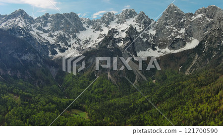 Green pasture and peaks of Apls mountain Green pasture and peaks of Apls mountain 121700590
