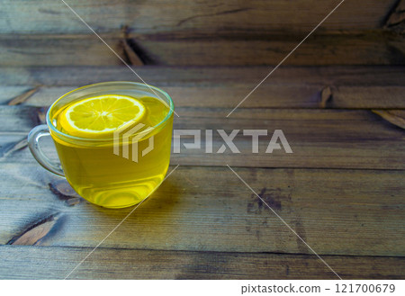 Green tea with lemon in a mug. 121700679