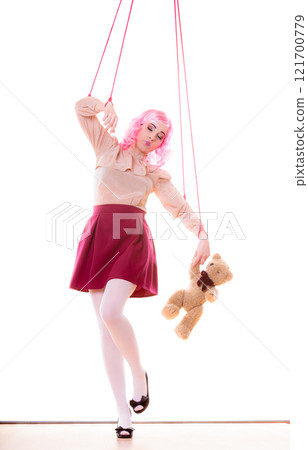 woman girl stylized like marionette puppet on string 121700779