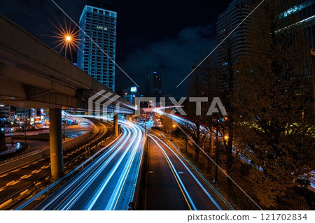 Light trails of cars running in the city at night Light trails of cars running in the city at night 121702834