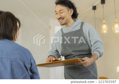 A man working at a cafe 121703597