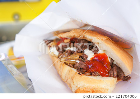 French bread sandwiches filled with lots of ingredients 121704006