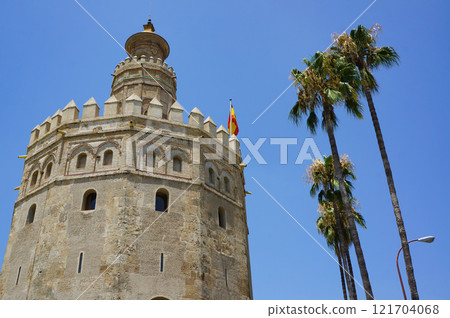A tower rising into the blue sky in Andalusia 121704068