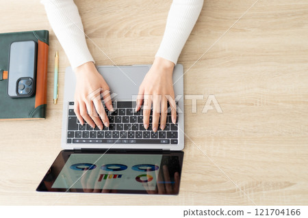 Woman entering data into a computer 121704166