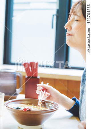 A young woman groans at the deliciousness A young woman groans at the deliciousness 121705288