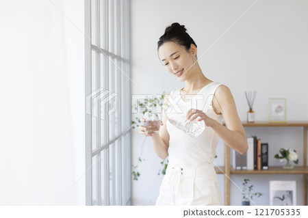 Diet woman drinking water Diet woman drinking water 121705335