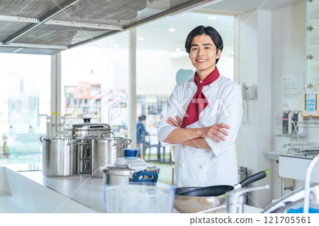 cook standing in the kitchen 121705561